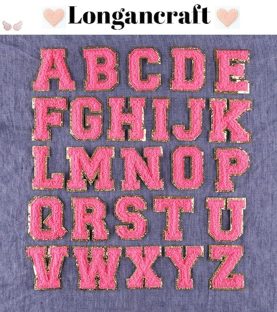 A group of Rose Red Chenille Iron On Letters