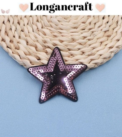 A pink star glitter sequins patch