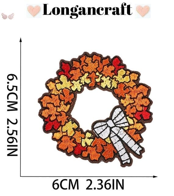 a autumn wreath embroidered patch with bows and leaves.