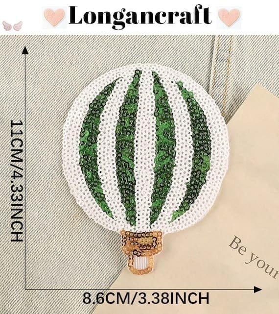 A green and white hot air balloon sequin embroidered patch