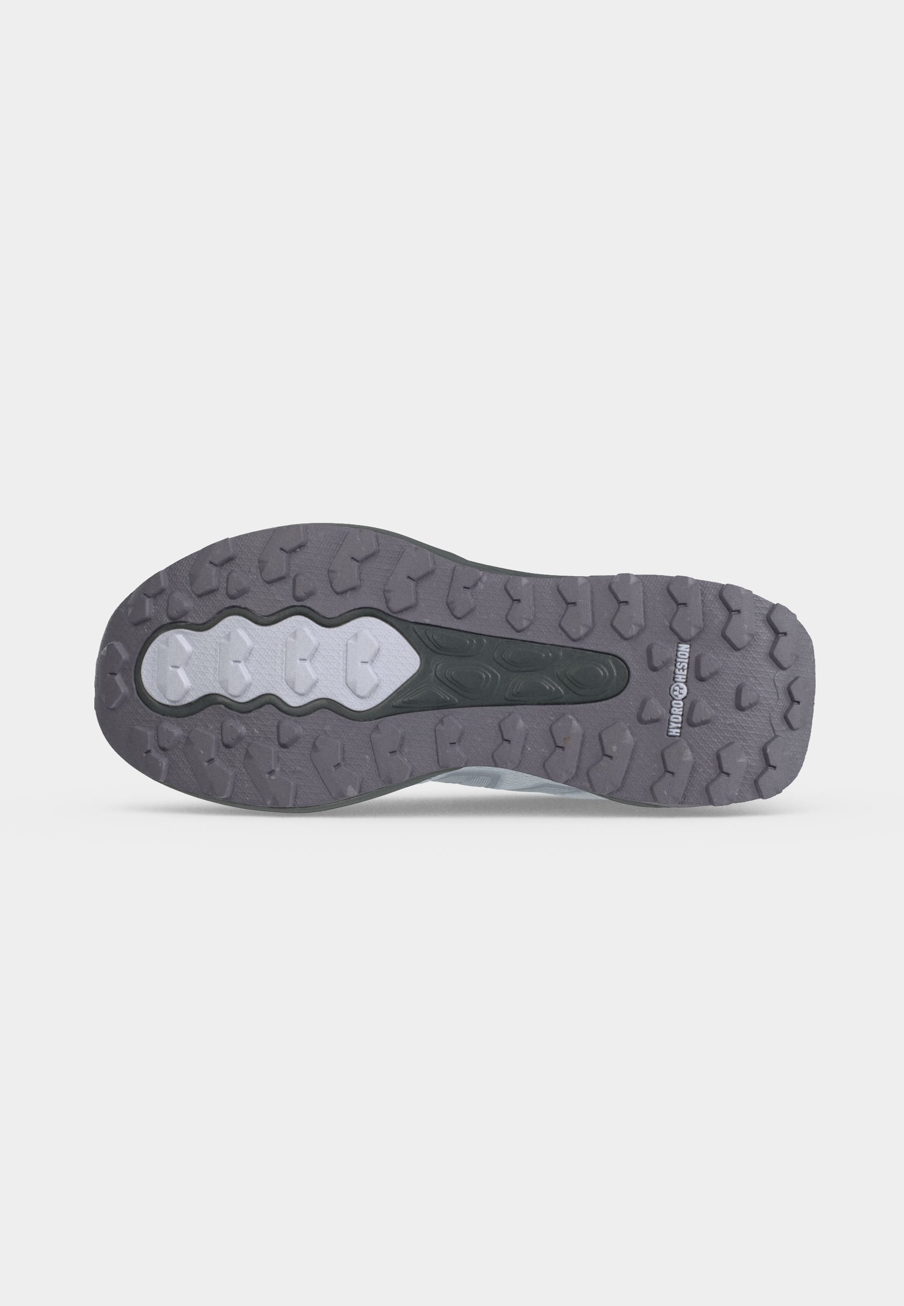 Suela de zapato con patrón de dibujo resistente, con secciones de goma mezcladas en gris y blanco y la marca "Hydro Hesion" cerca del talón.