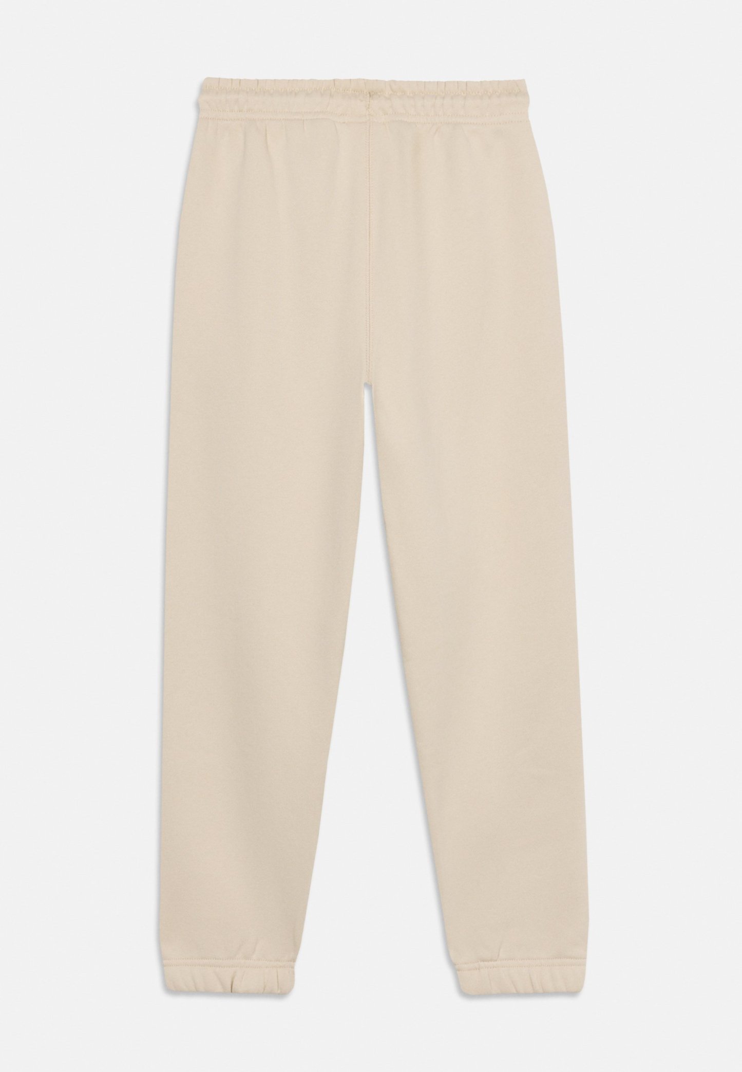 Pantalones deportivos casuales beige con cintura elástica y puños ajustados, presentados planos sobre un fondo blanco.