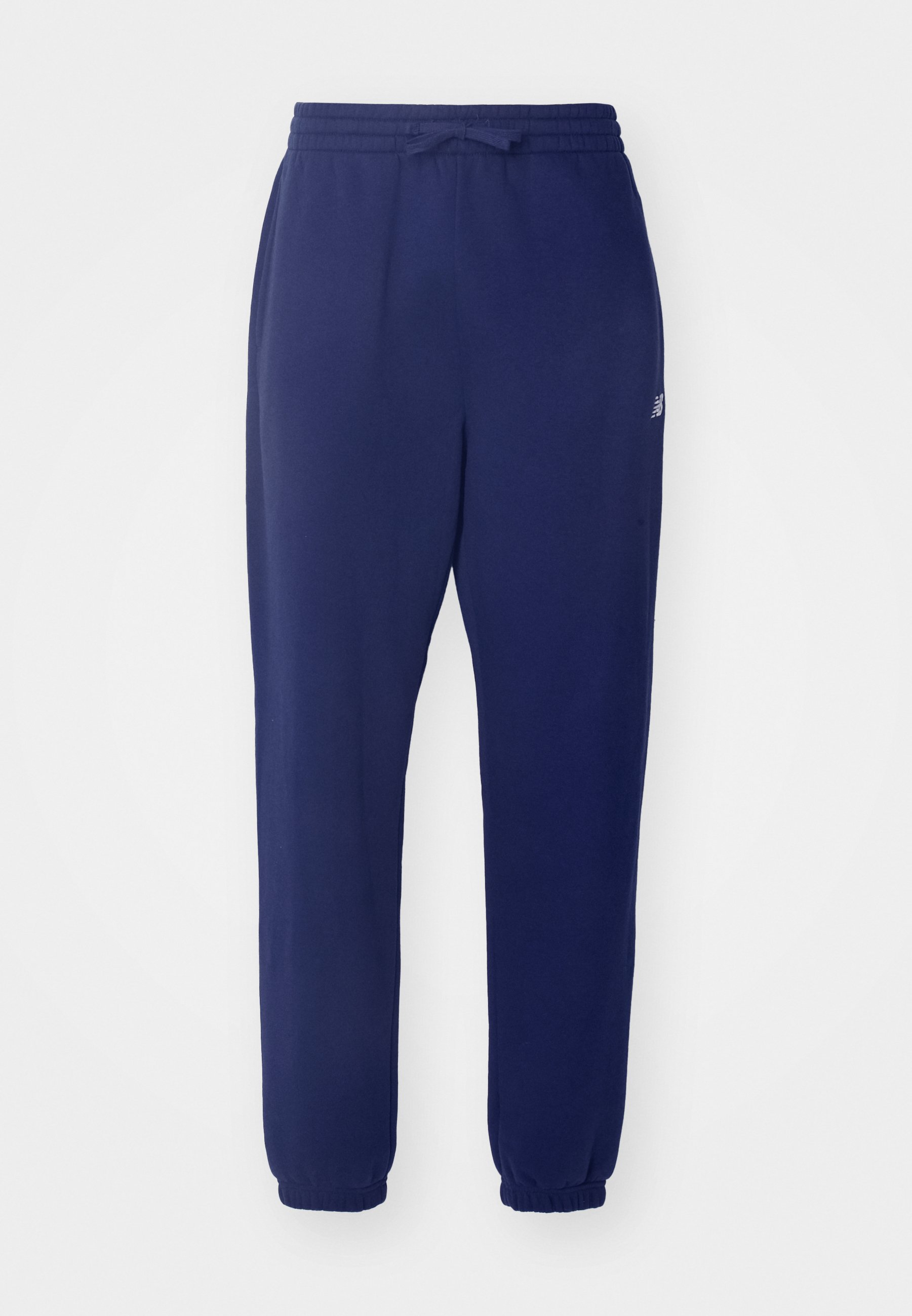 Joggers de color azul marino, con cintura elástica y cordón, piernas ajustadas y puños acanalados. Fabricados con una tela suave y con un branding mínimo.
