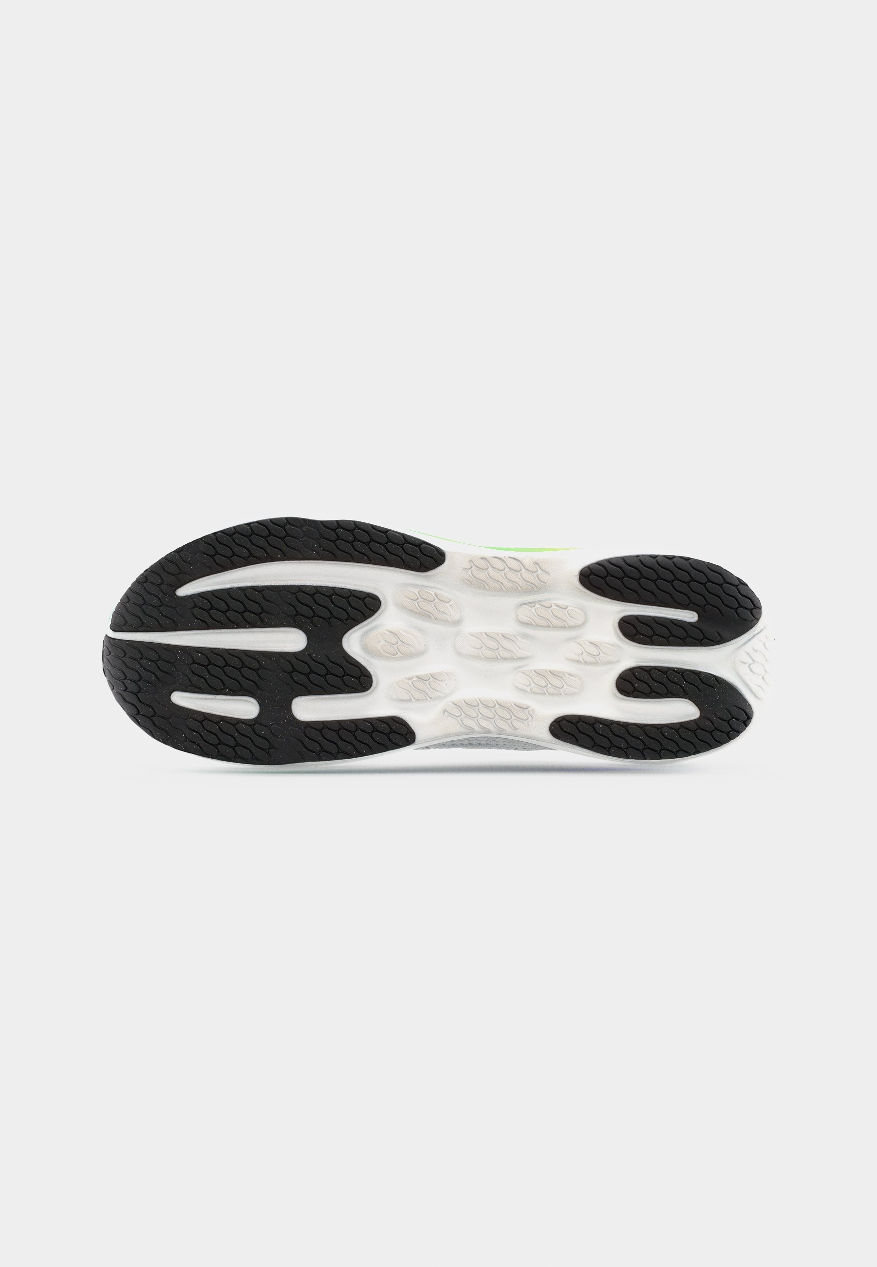 Suela exterior de un zapato deportivo con dibujo de caucho en blanco y negro diseñado para tracción y durabilidad.