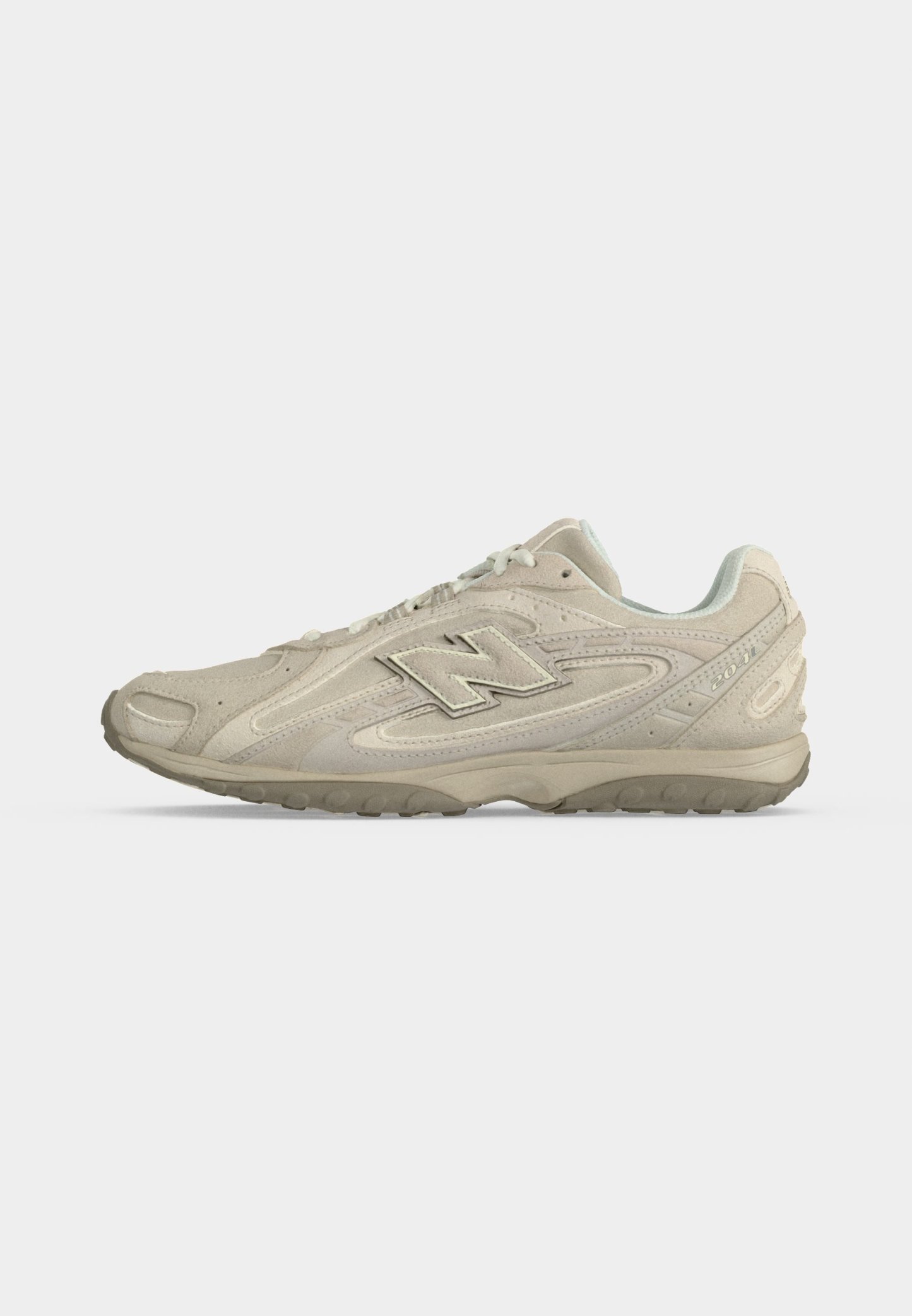 Zapatilla beige New Balance 2002R con parte superior de ante y malla, cierre con cordones y suela exterior de goma texturizada, vista de perfil.
