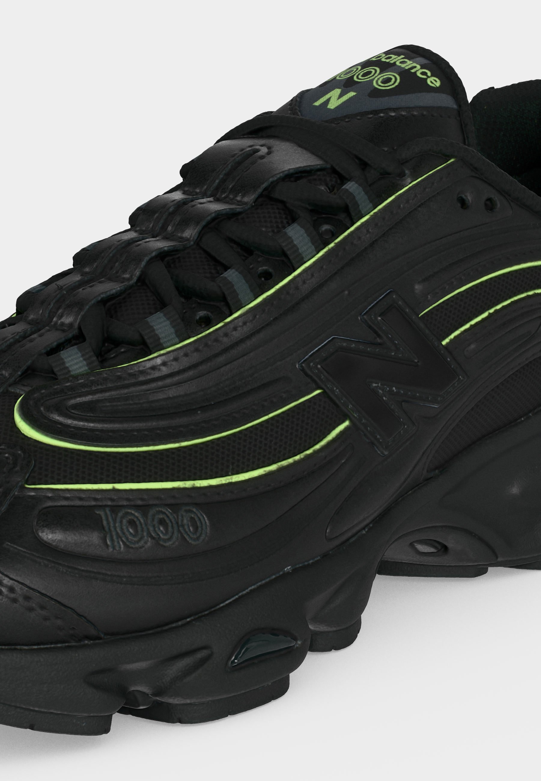 Zapatilla negra New Balance 1000 con acentos en verde neón, materiales de malla y cuero, cierre con cordones y suela gruesa acolchada.