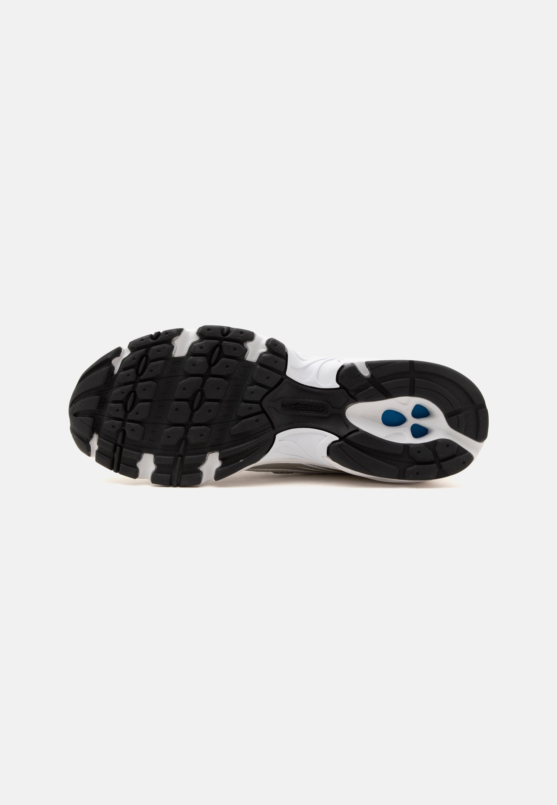 Suela de zapato deportivo blanco y negro con dibujo texturizado y cápsulas acolchadas azules en la zona del talón.