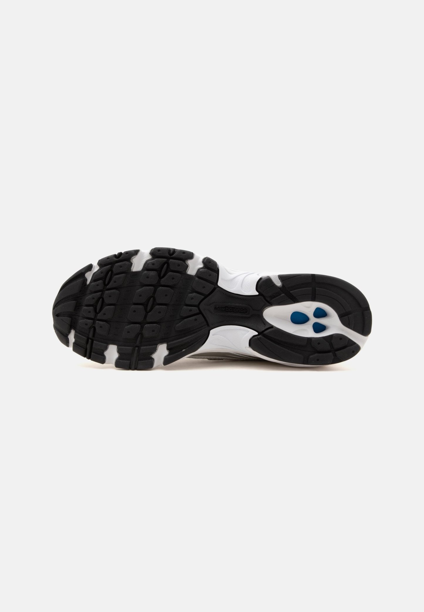 Suela de zapato deportivo blanco y negro con dibujo texturizado y cápsulas acolchadas azules en la zona del talón.