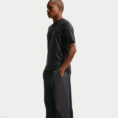 Nike Tech - Nike Tech Fleece-Hose mit offenem Saum und Farbblock-Design (Herren)