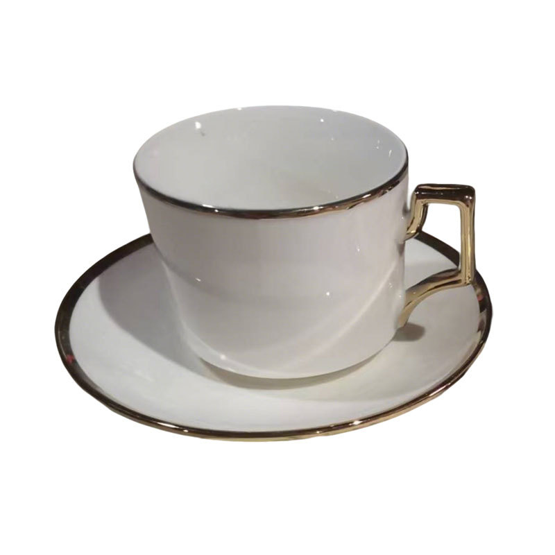 Gold-rimmed white ceramic cup and saucer set