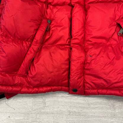 The North Face Red Baltoro Puffer Jacket WITH STAIN