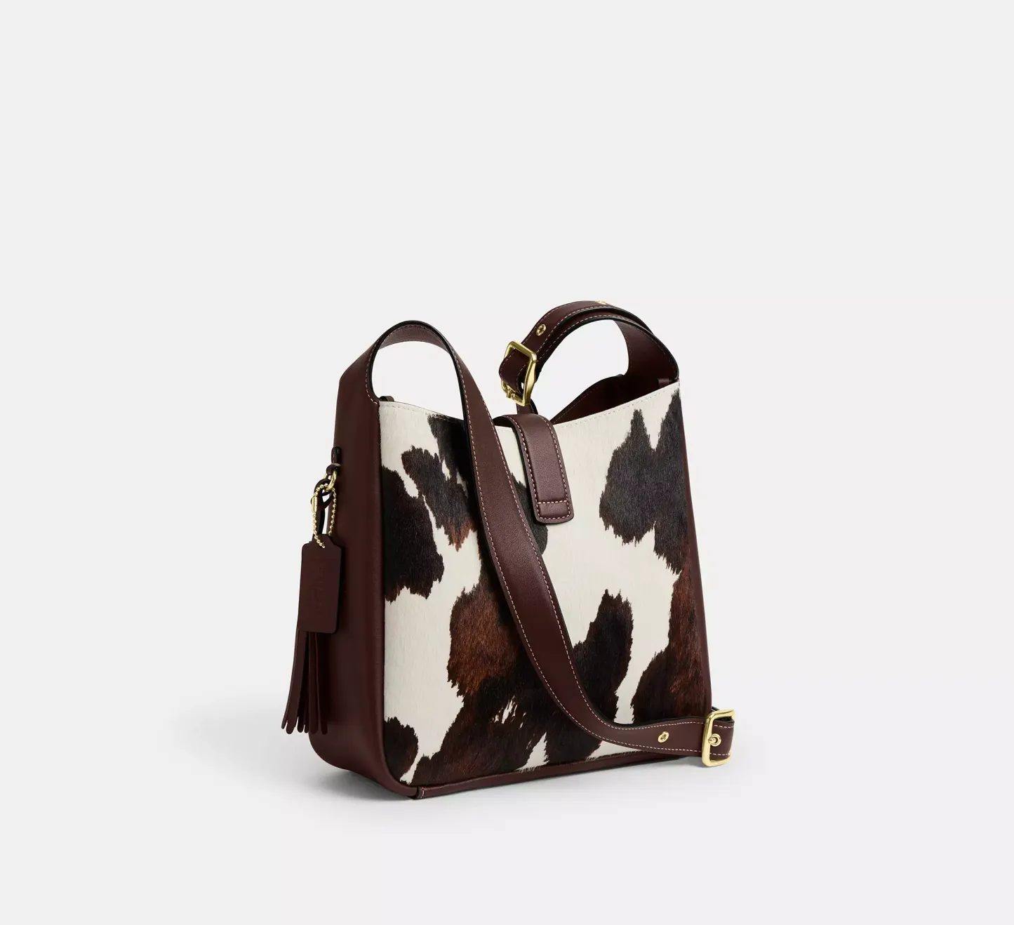 Hadley Convertible Crossbody Bag With Cow Print And Tassel