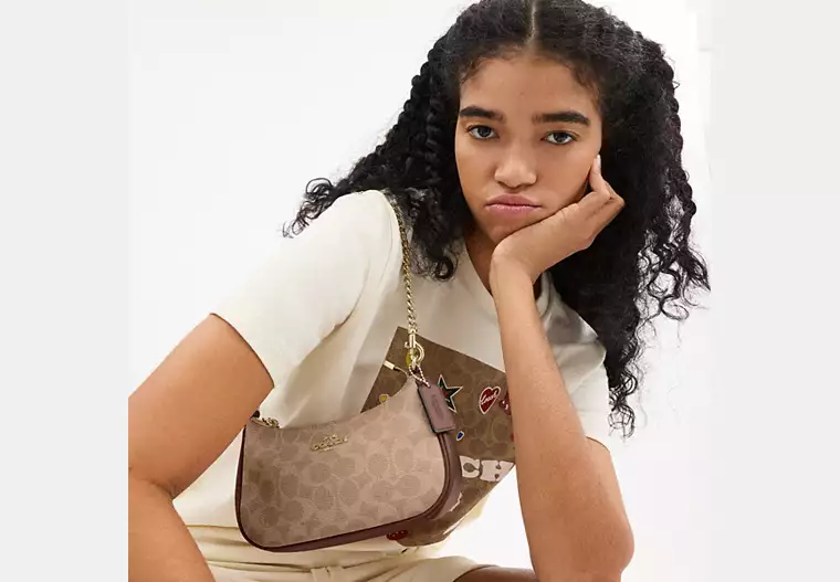 Teri Mini Crossbody Bag In Signature Canvas