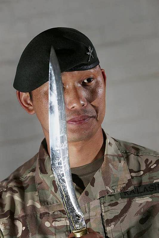 Gurkha man holding Chainpure Kukri