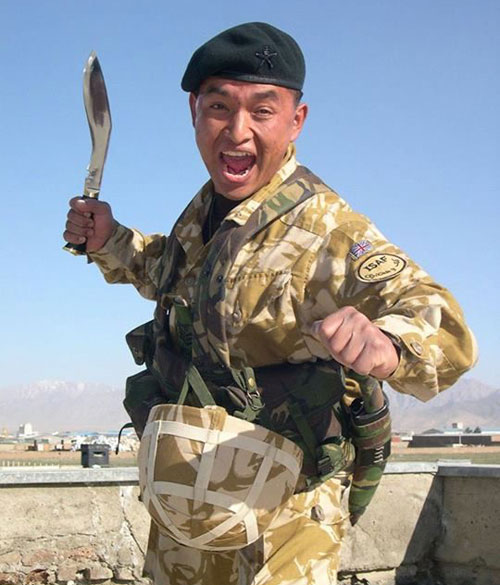 gurkha soldier in war cry action wih service khukuri