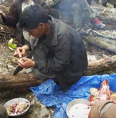 cutting meat with Khukuri