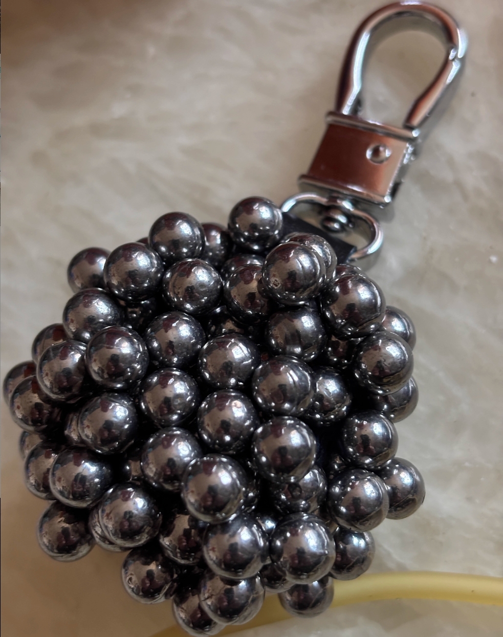 Strong magnetic pendant, slingshot force magnet, steel ball and iron attracting outdoor pendant, slingshot key buckle