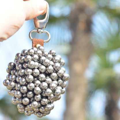 Strong magnetic pendant, slingshot force magnet, steel ball and iron attracting outdoor pendant, slingshot key buckle