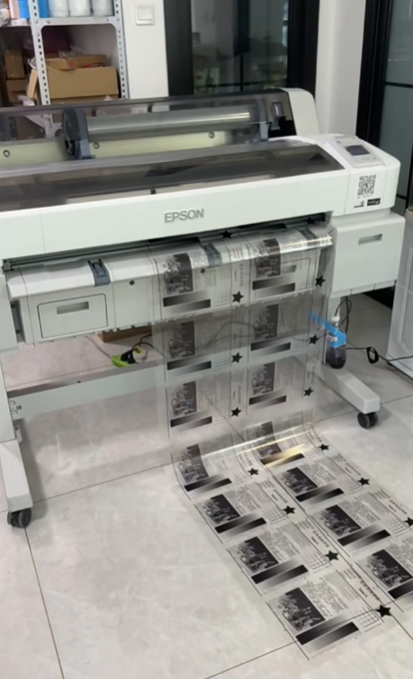 Inkjet printer outputting film positives for screen printing stencils.