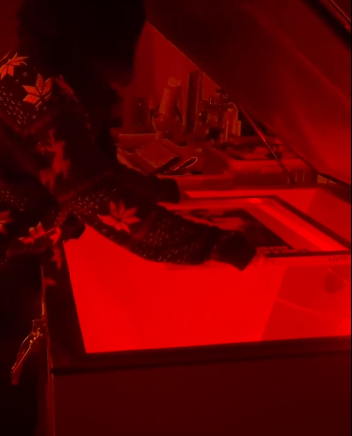 Screen exposure work under red safe light in a darkroom