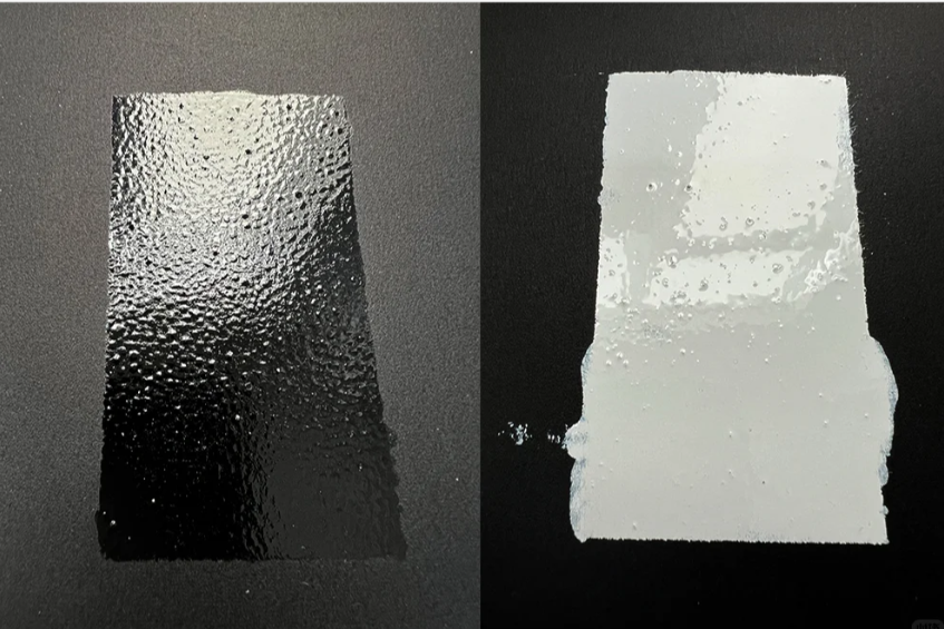Ink deposit test: glossy black vs white ink layer (print sample close-up).