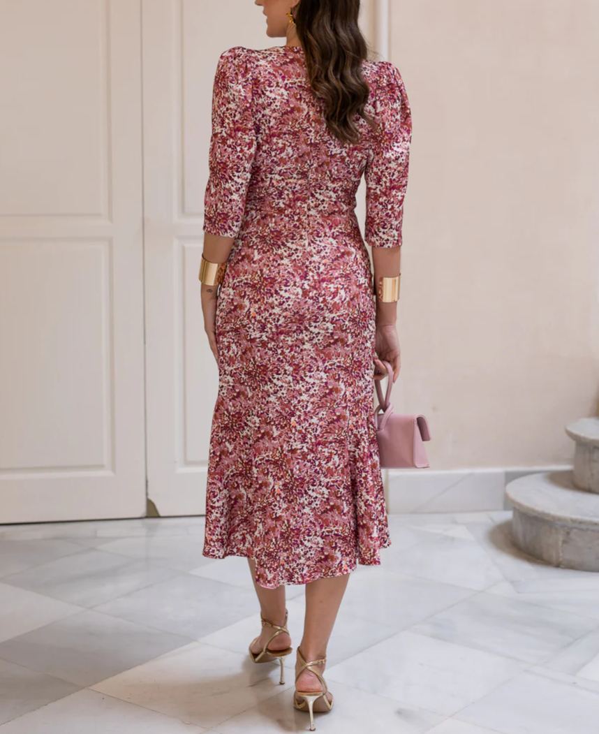 Midi dress with a floral print in shades of pink and terracotta.