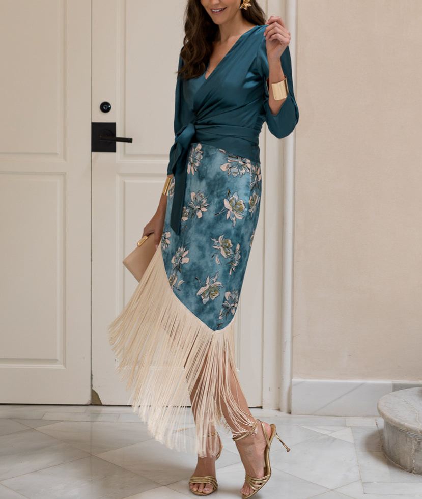 Blouse and fringed skirt set in petrol blue.