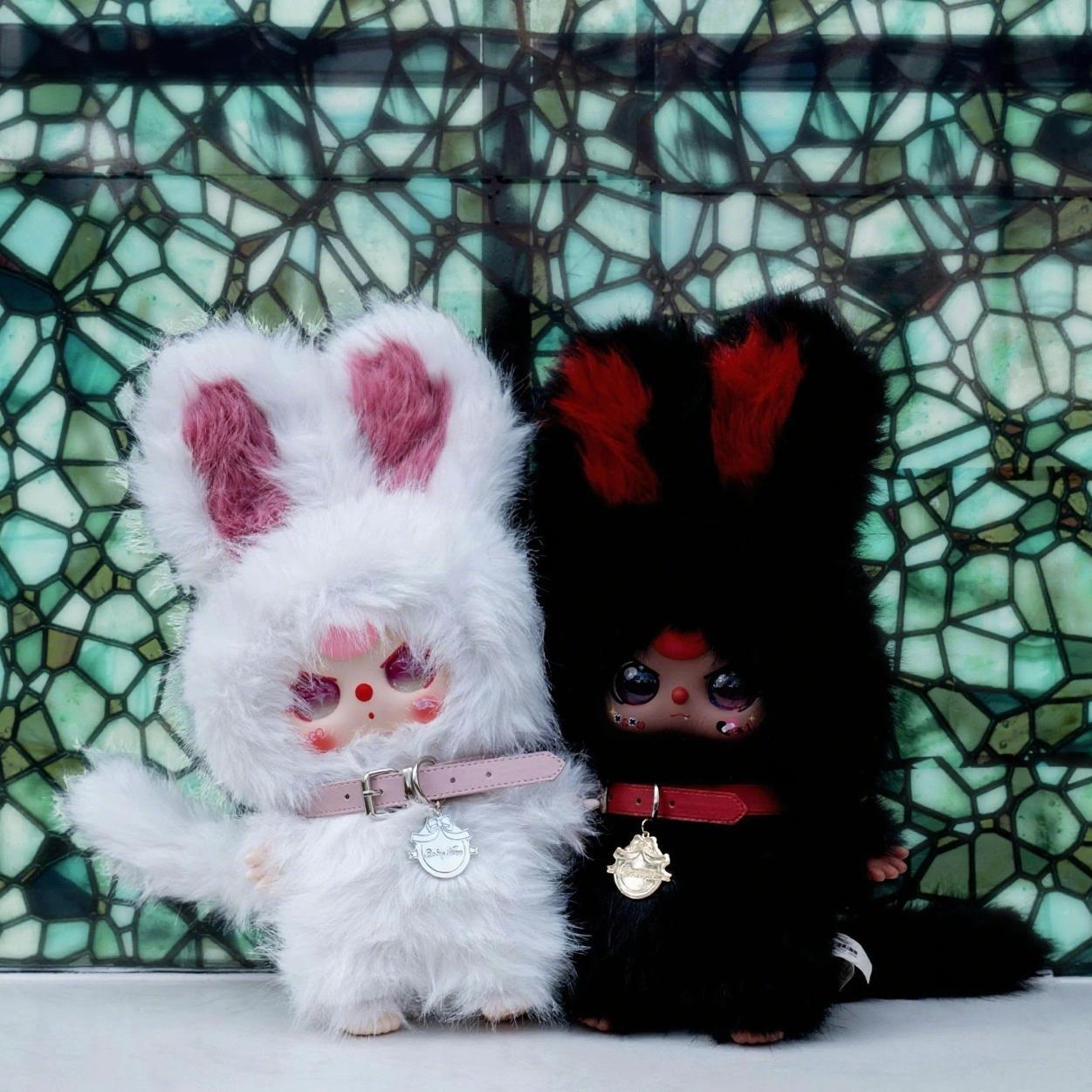 Three-year-old black and white twin plush