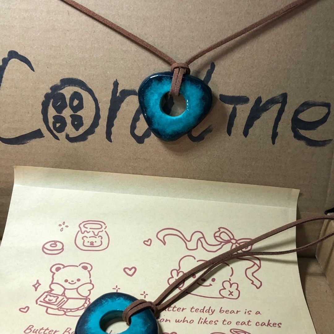 Coraline Glow-in-the-Dark Caramel Candy Pendant