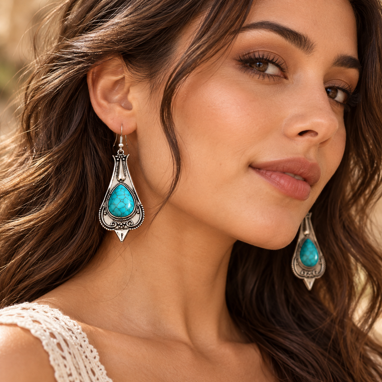 Close-up view of Desert Sky turquoise earrings worn on the ear