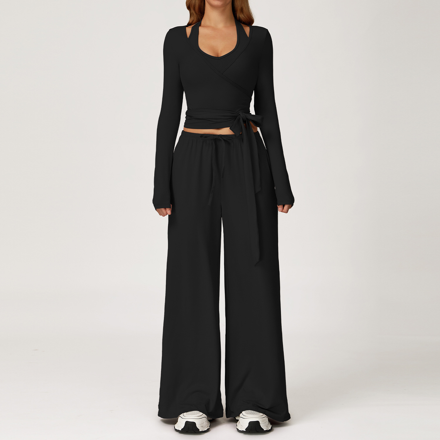 Women's Casual Sportswear Set — A slim-fitting, summer-style athletic outfit crafted from silky-feel polyester. It features an adjustable V-neck camisole paired with wide-leg trousers. Cool, quick-drying, and breathable, this set accentuates your alluring