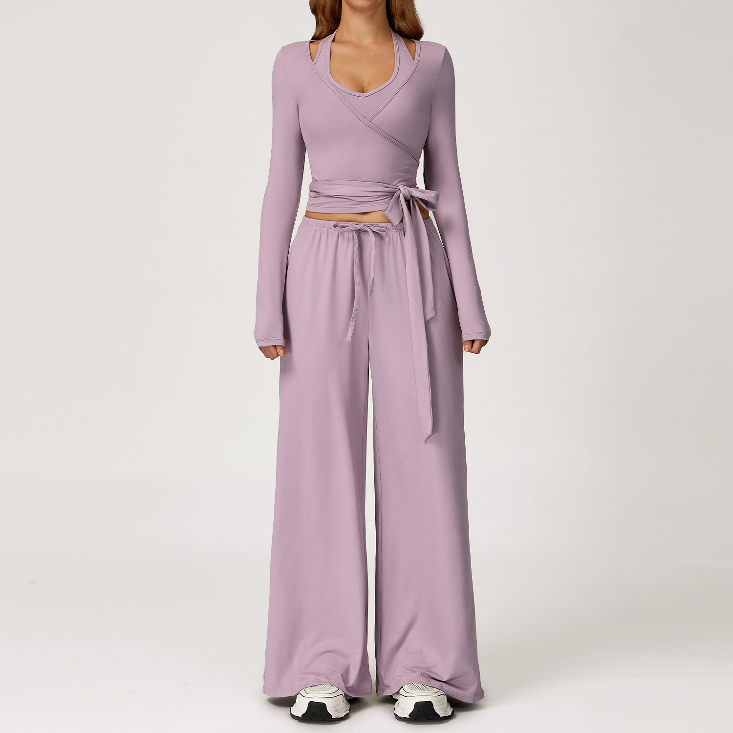 Women's Casual Sportswear Set — A slim-fitting, summer-style athletic outfit crafted from silky-feel polyester. It features an adjustable V-neck camisole paired with wide-leg trousers. Cool, quick-drying, and breathable, this set accentuates your alluring