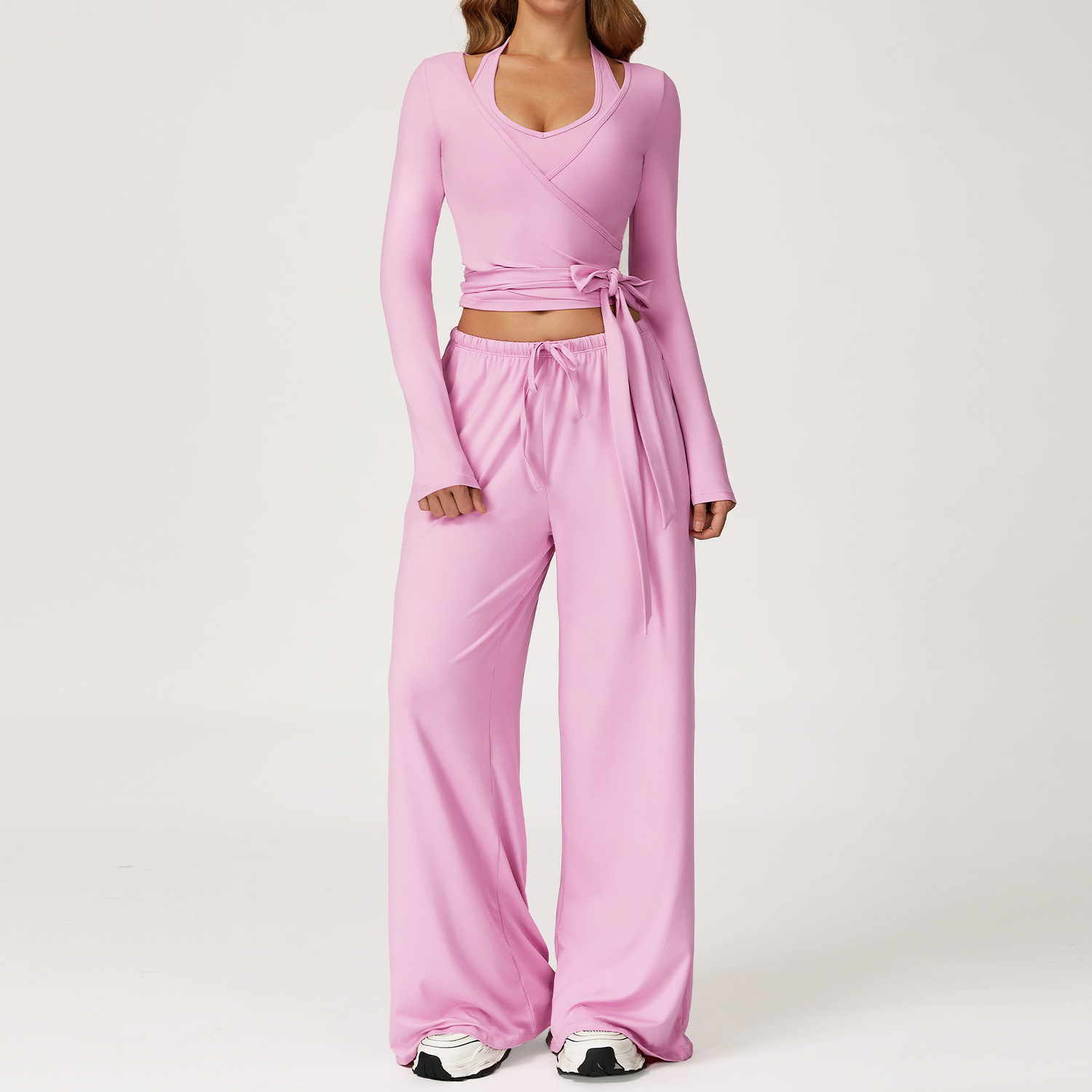 Women's Casual Sportswear Set — A slim-fitting, summer-style athletic outfit crafted from silky-feel polyester. It features an adjustable V-neck camisole paired with wide-leg trousers. Cool, quick-drying, and breathable, this set accentuates your alluring