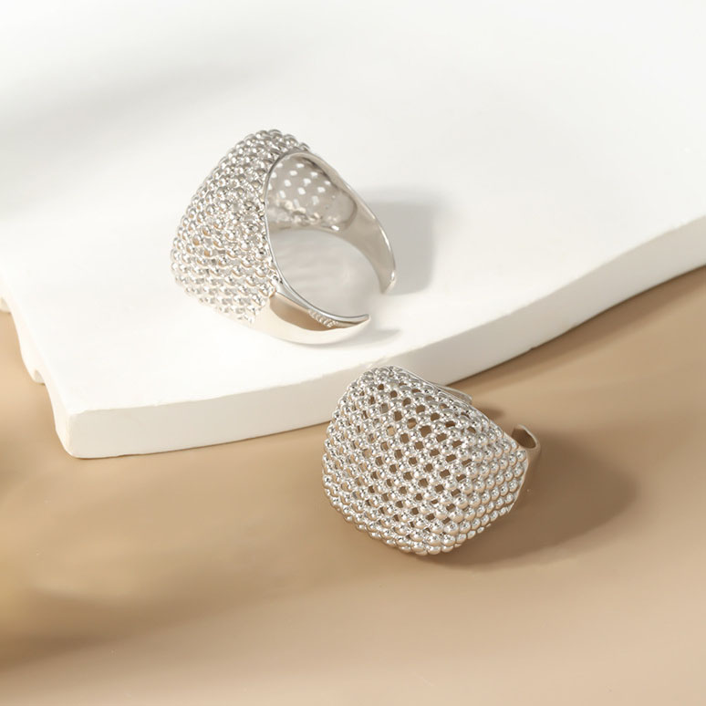 Overhead flat lay of Openwork Bead Adjustable Ring S925 on marble surface