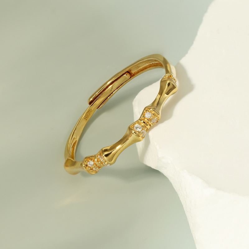 Top down macro shot of cubic zirconia setting on bamboo-inspired ring design

