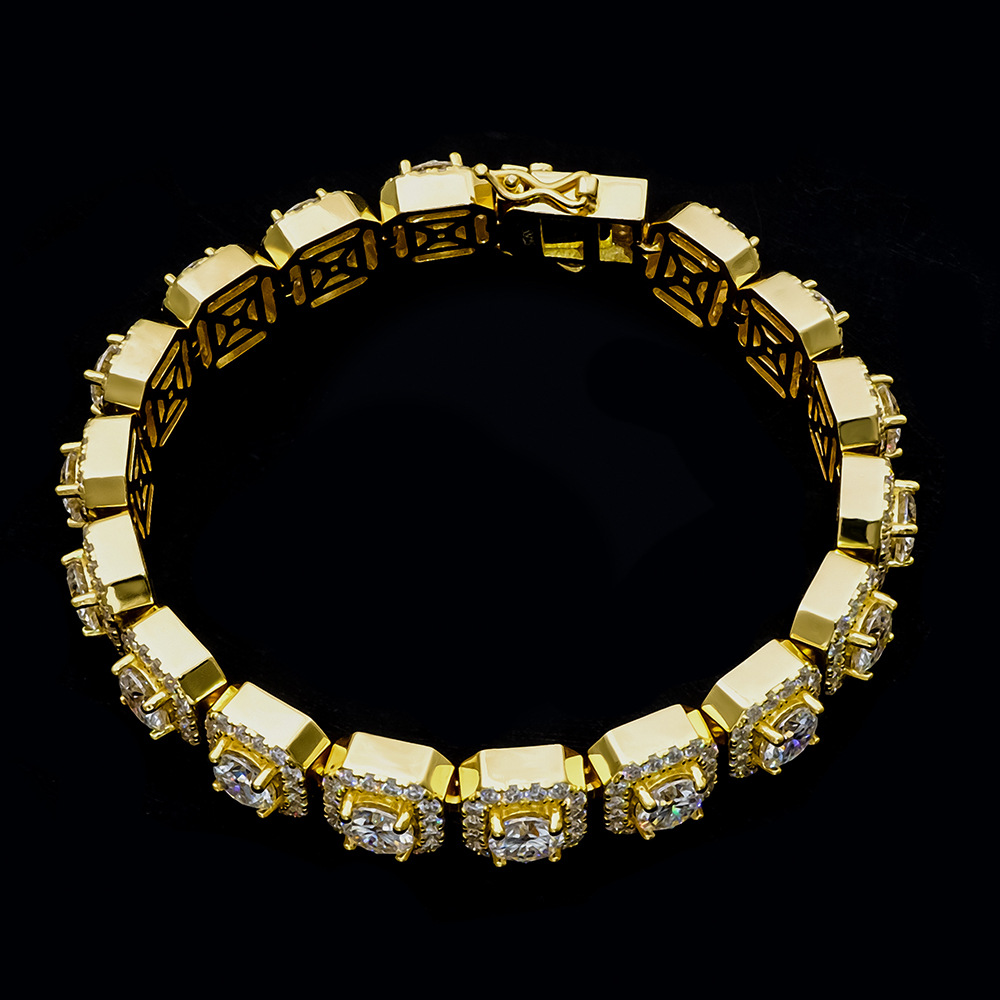Close-up top view of the men's wide gold bracelet, highlighting the secure box clasp