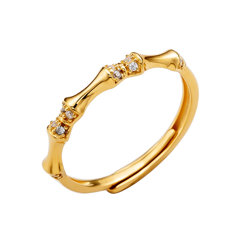 Isolated solid silver CZ bamboo ring on white background, studio product shot