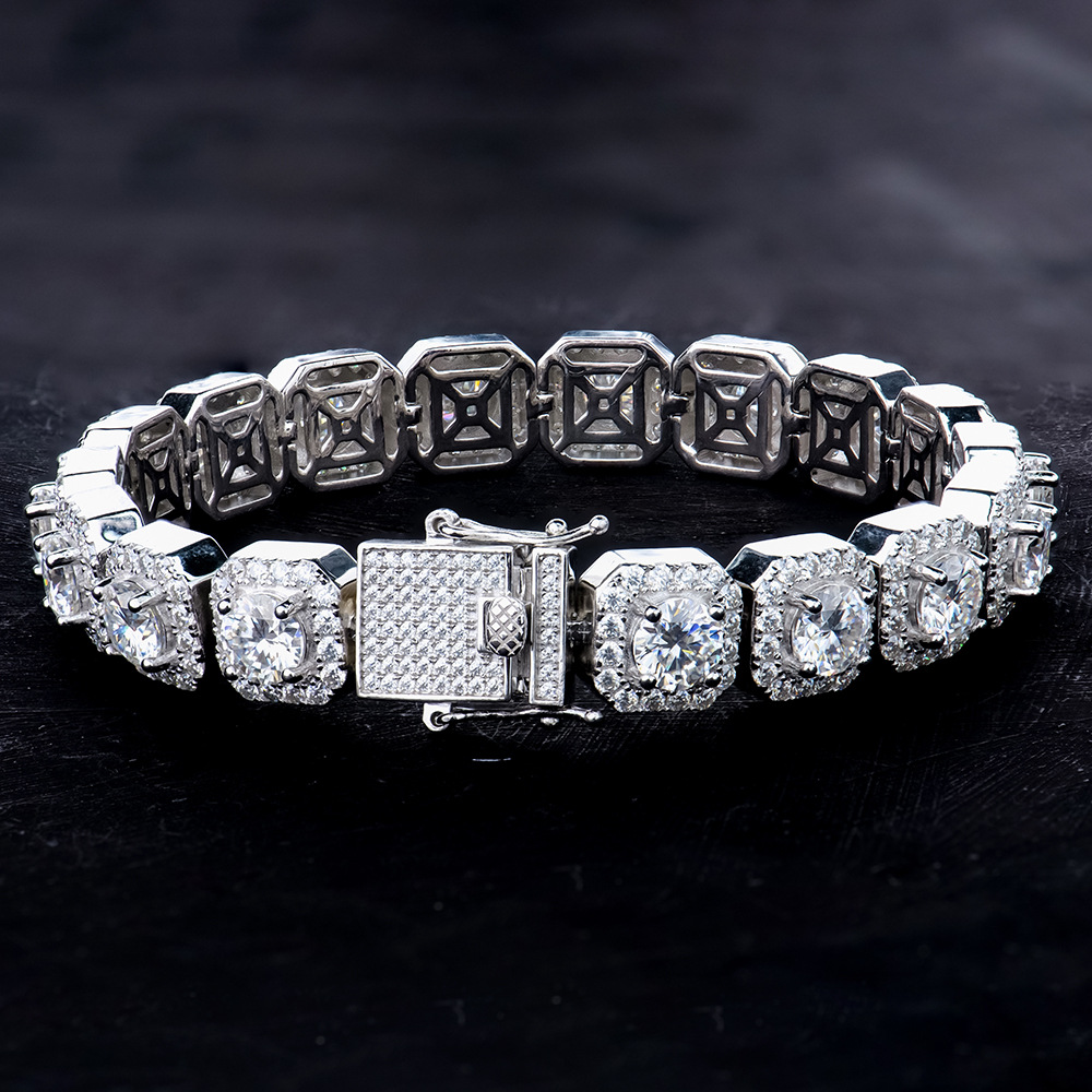 Top down shot of the sleek sterling silver iced out bracelet on a black felt surface