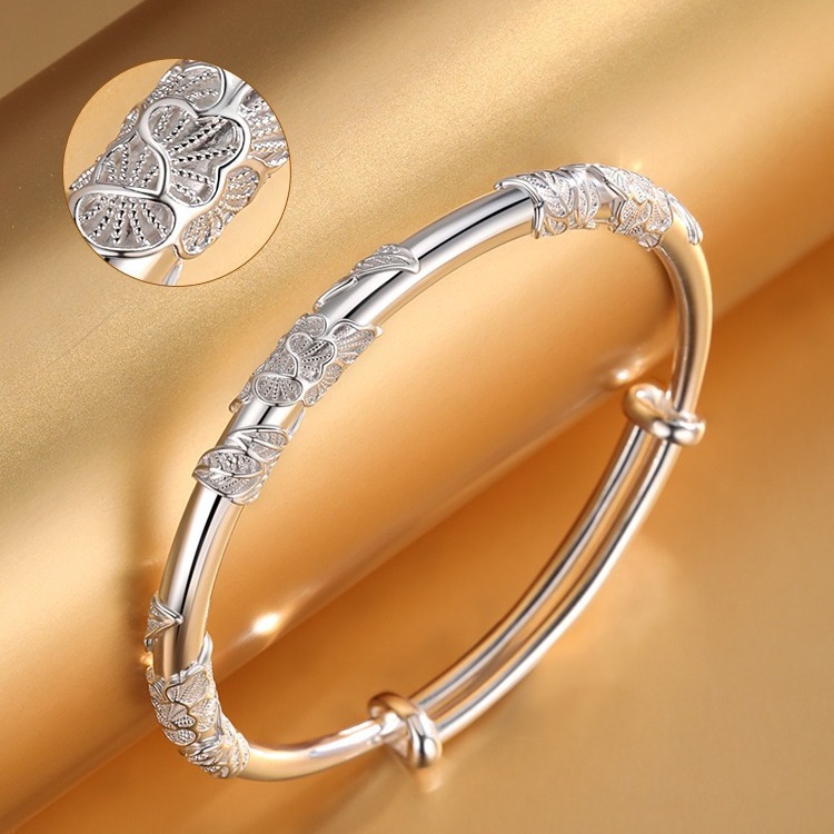 Intricate detail of the handmade Chinese filigree art and floral pattern on the silver bracelet