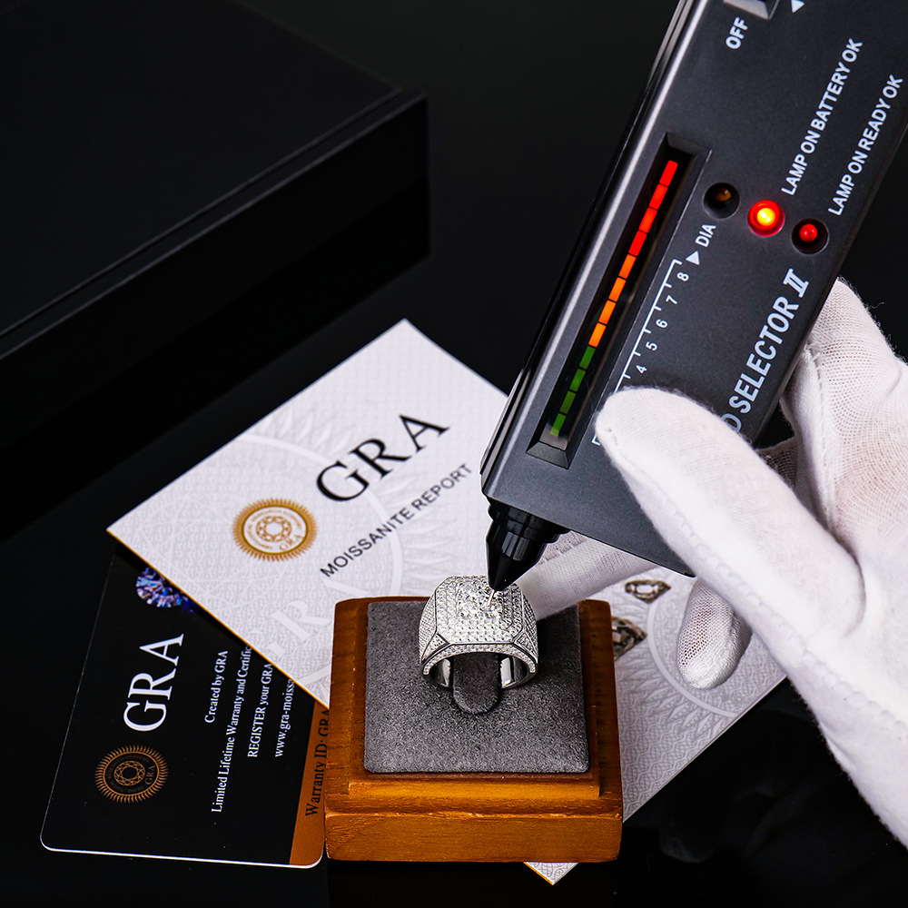 Moissanite certification and authenticity verification document with magnification