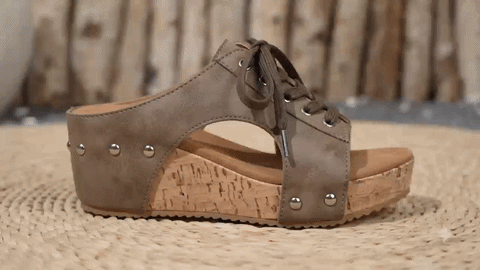 Hero image: woman wearing retro wedge sandals while walking comfortably in summer