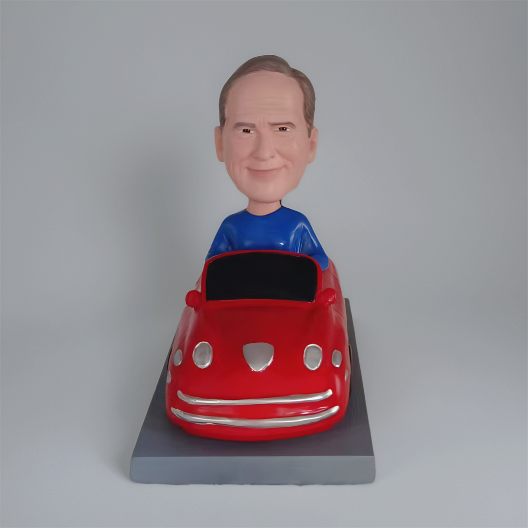 bobbleheads man in car