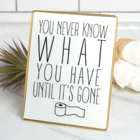 Gold Framed Bathroom Sign on Stand