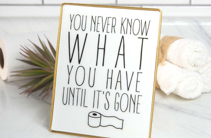 Gold Framed Bathroom Sign on Stand