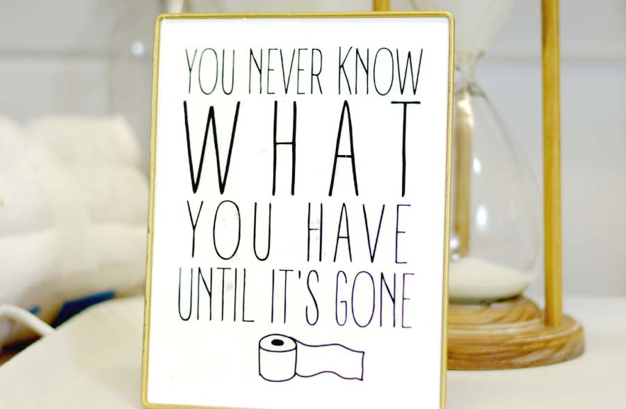 Gold Framed Bathroom Sign on Stand