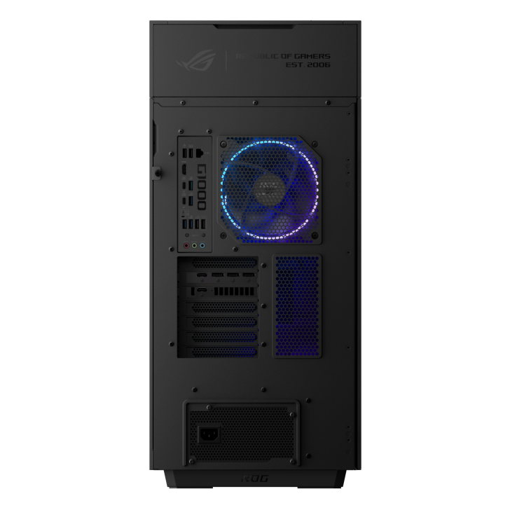 The back panel of an ASUS ROG Strix G15 gaming desktop with multiple ports, a ROG logo fan, and '1000' on the power supply unit.