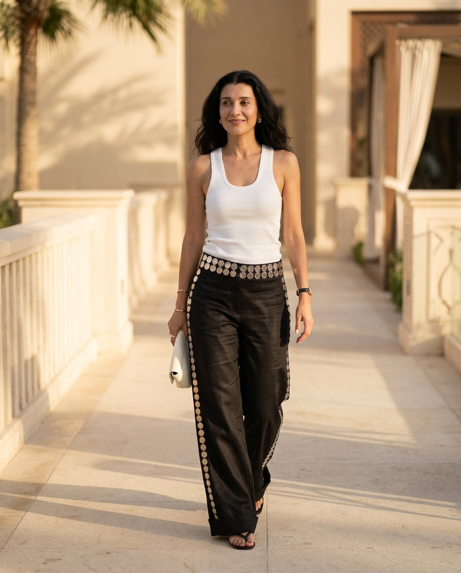 Black Poise Resort Linen Pants Black Pants with Asymmetric silhouette and Linen Blend texture, lifestyle scene image for Resort Wear, Evening in Amalfi, Euro Chic Premium by rovole