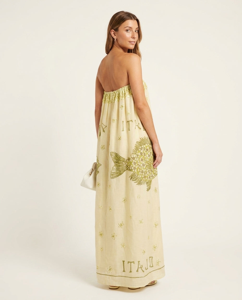 Pale Yellow Eyelet Strapless Maxi Dress "Estelle" Pale Yellow Maxi Dress with Asymmetric silhouette and Linen Blend texture, side or back garment view for Resort Wear, an estate dinner at golden hour, US East / Hamptons Elite
