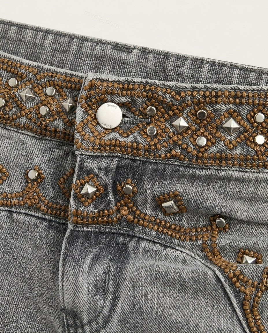 Grey Embroidered Denim Pants, close-up of bronze and silver accents, embellished waistband and embellished hip pockets, by rovole.com