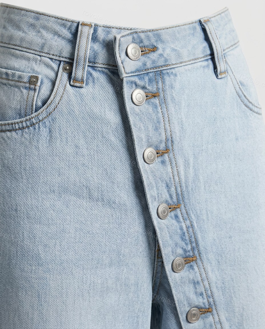 Blue Asymmetric Denim Pants Set, close-up of silver and brown accents, belt loops and front pockets, by rovole.com